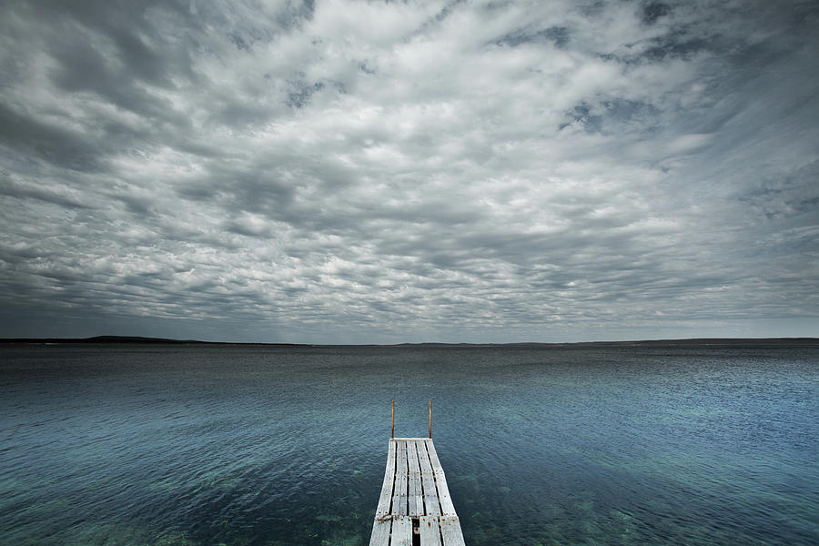 Small Jetty And Stormy Sky. Proper Bay Photograph by John White Photos