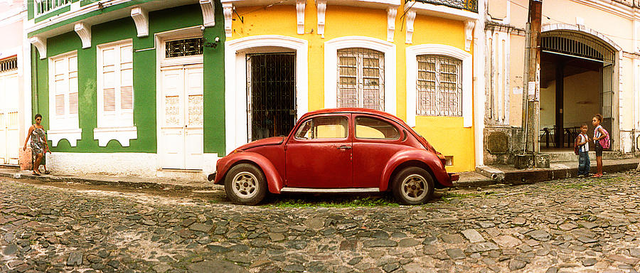 Architecture Photograph - Small Old Red Car Parked In Front by Panoramic Images