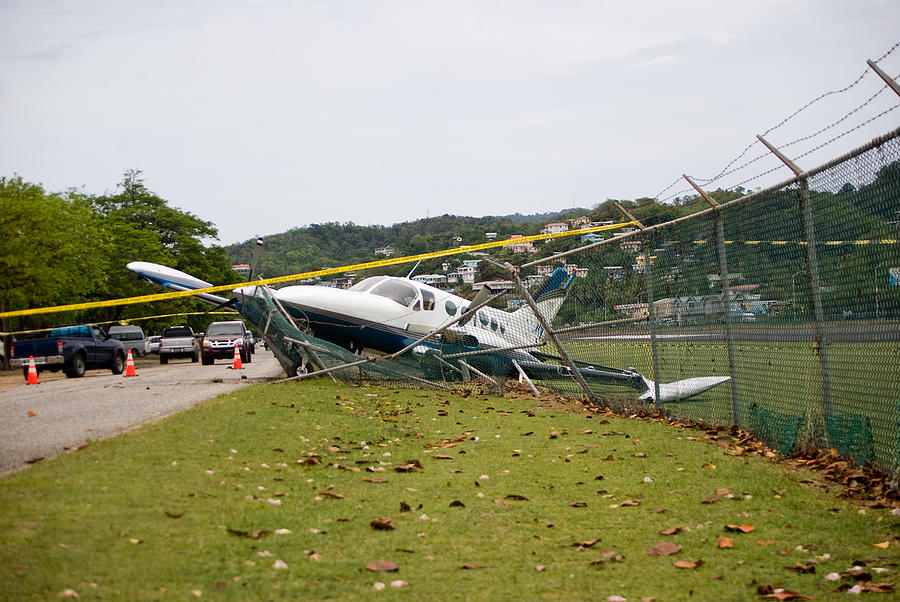 Small Plane Crashes Through Fence On Highway In Emergency Landing Photograph by Jaminwell