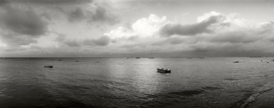 Black And White Photograph - Small Wooden Boat In The Ocean, Morro by Panoramic Images