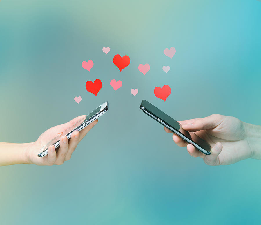 Smart phone love connection Photograph by PM Images