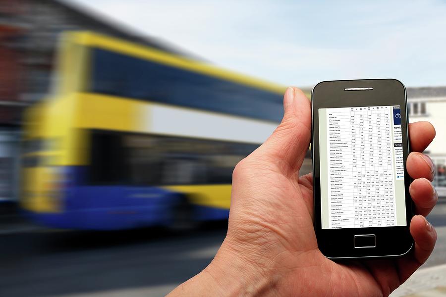 Smartphone And Bus Timetable Photograph by Victor De Schwanberg/science Photo Library