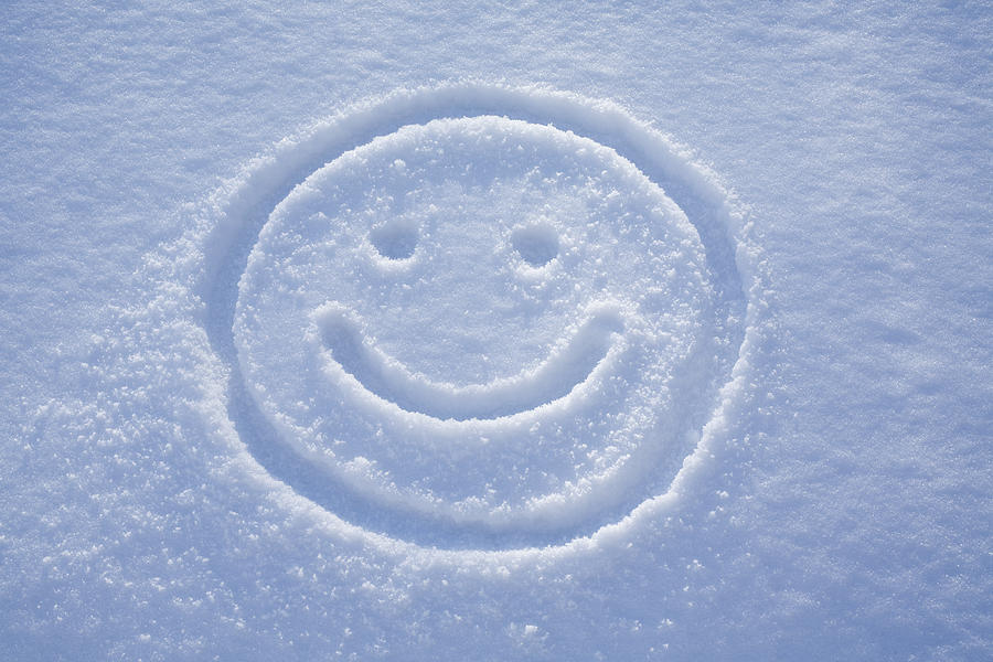 Smile. A face drawing in the snow. Photograph by Malerapaso
