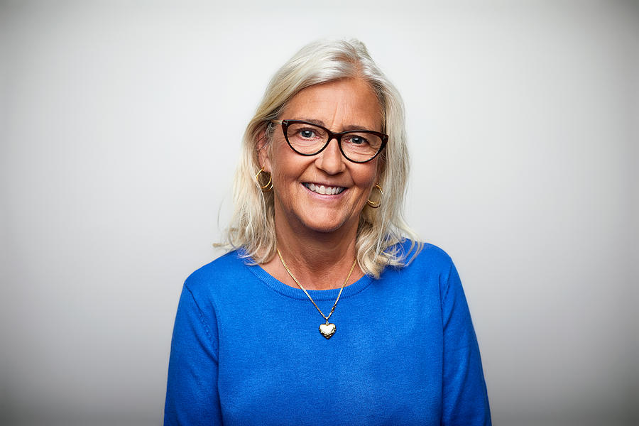 Smiling senior woman wearing eyeglasses Photograph by Morsa Images