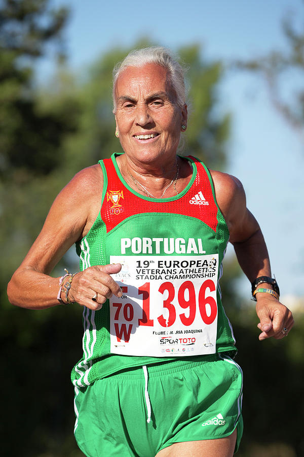 Smiling Silver-haired Female Athlete Photograph by Alex Rotas