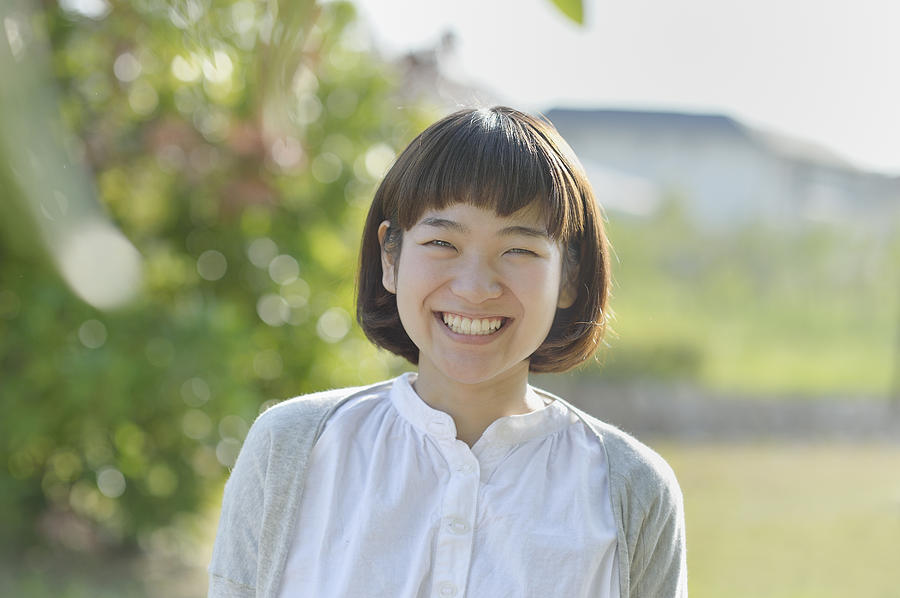 Smiling Woman in the green Photograph by Yagi Studio