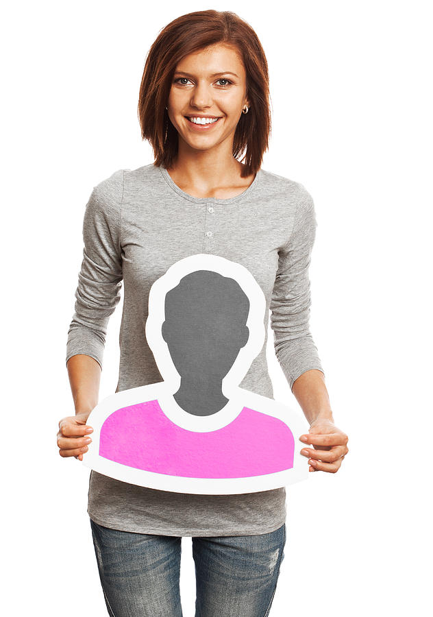 Smiling young woman holding profile image sign isolated on white. Photograph by IngredientsPhoto