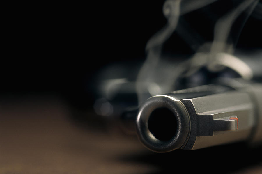 Smoking gun lying on the floor, revolver Photograph by Cmannphoto