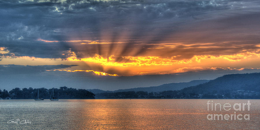 Smoky Rays Sunrise wallpaper screensaver and photo download. Photograph by Geoff Childs