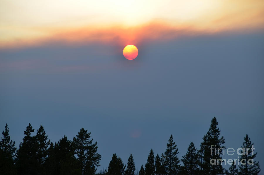 Smoky Sunset in Yellowstone Photograph by Debra Thompson