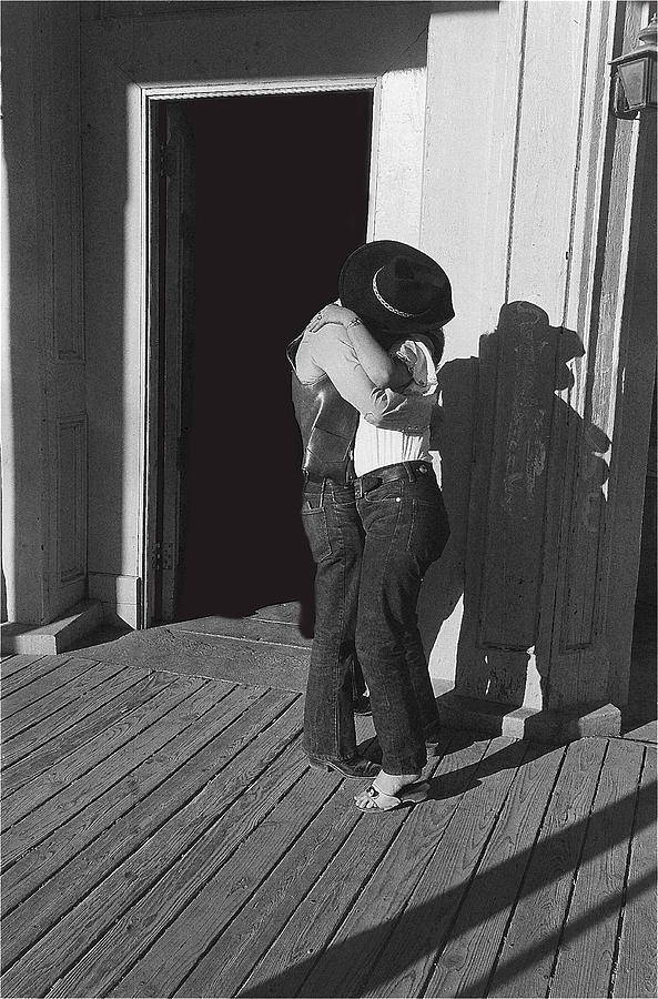 Smooching couple front entrance Crystal   Palace Saloon Tombstone Arizona 1980  Photograph by David Lee Guss
