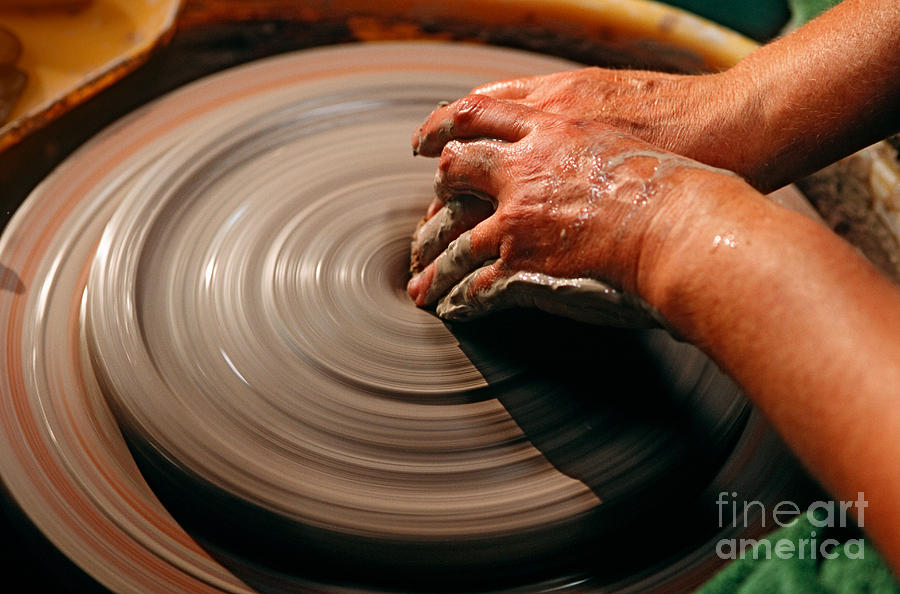 Smoothing Clay Photograph by James L. Amos
