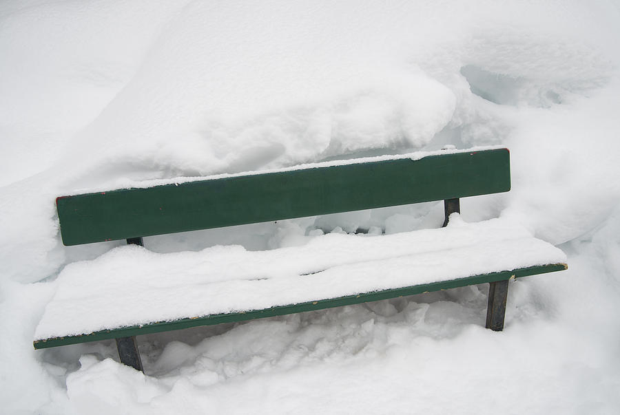 Snow-covered green bench in winter with lots of snow Photograph by Matthias Hauser