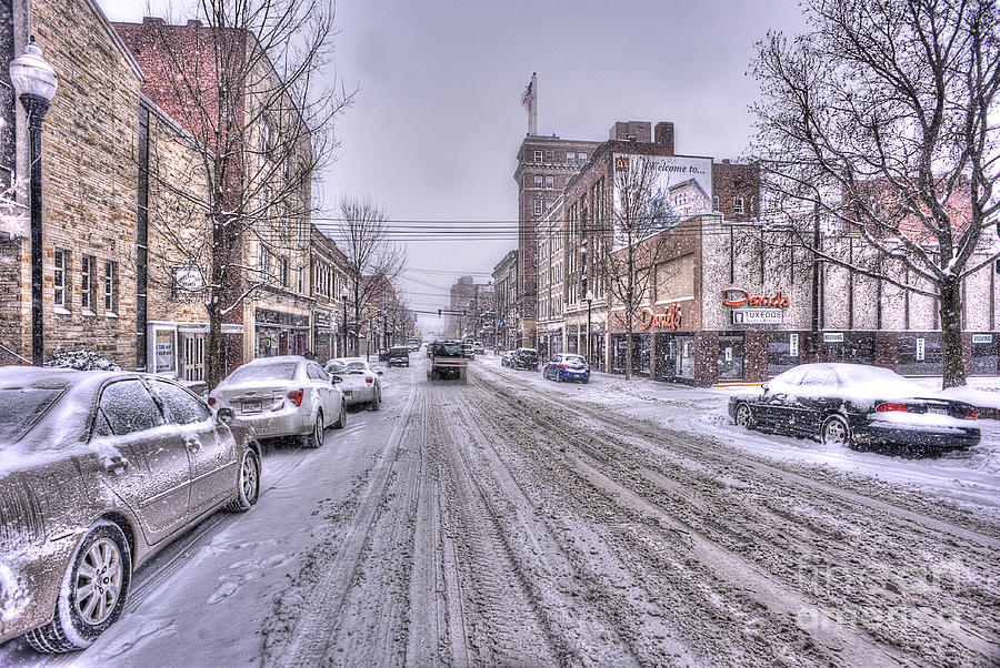 Snow covered high street and cars in Morgantown Photograph by Dan Friend