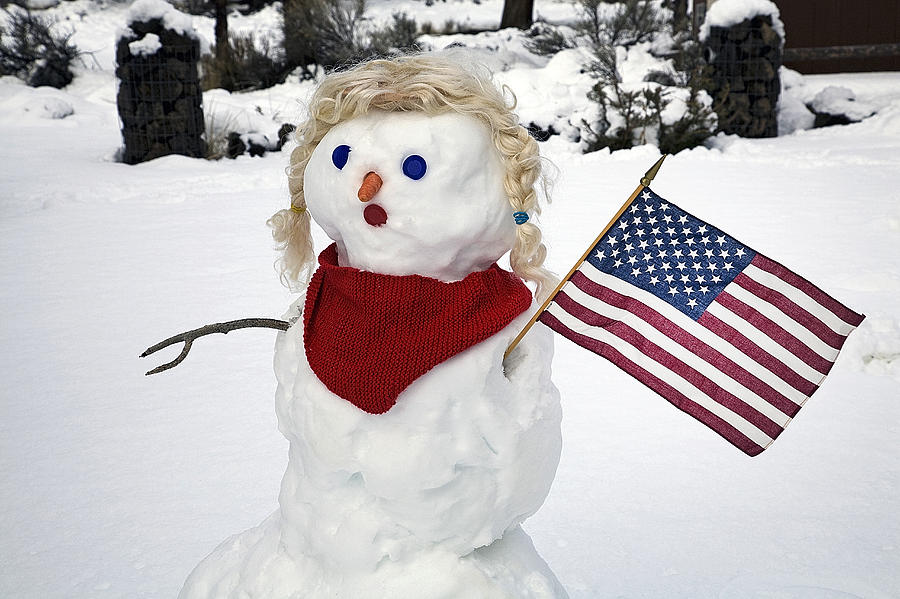 Snow woman with flag Photograph by Buddy Mays