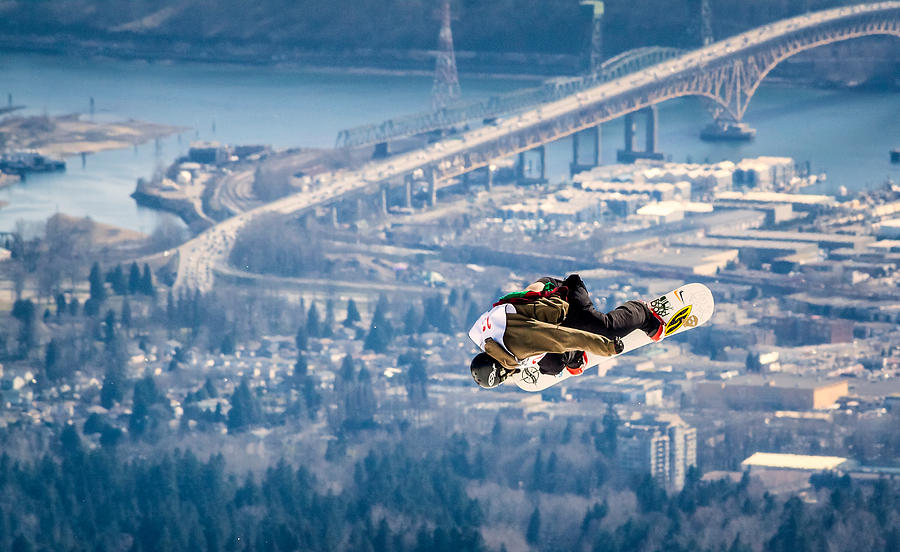 Snowboarding over the City Photograph by Alexis Birkill