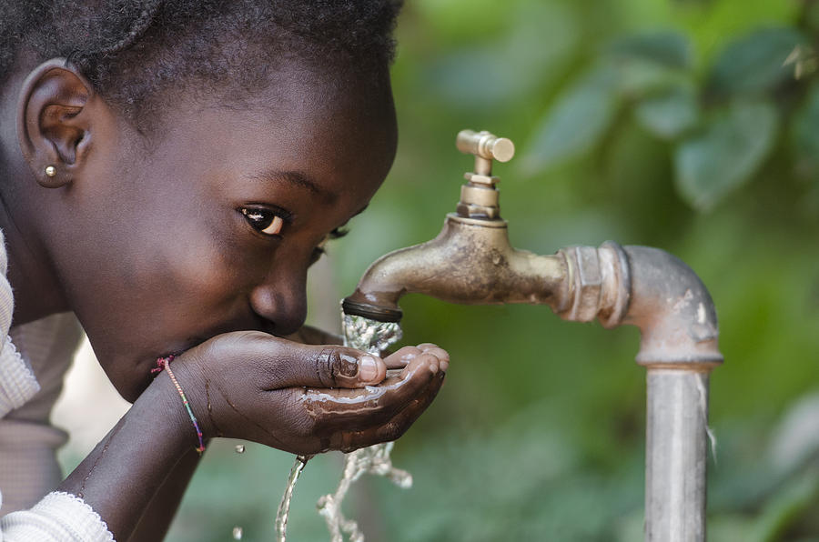 Social Issues: African Black Child Drinking Fresh Water From Tap Photograph by Borgogniels