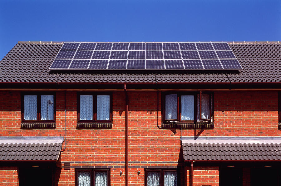 Solar Panel Photograph - Solar Panels On The Roof Of Terraced Houses by Alex Bartel/science Photo Library