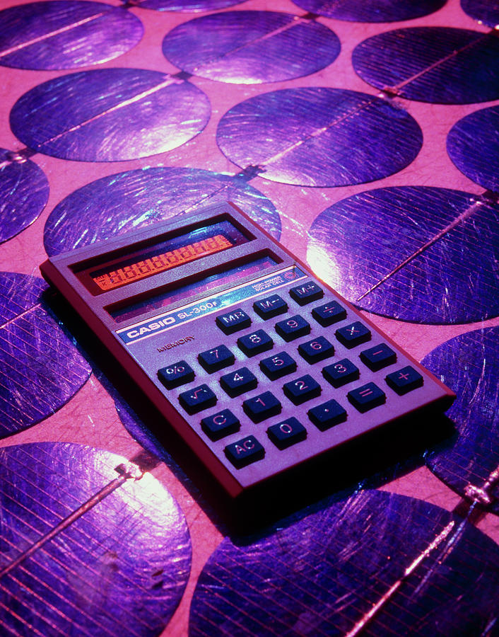Solar Powered Calculator On Photovotaic Cells Photograph by Martin Bond/science Photo Library