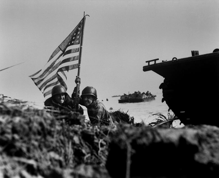 Soldiers Plant The American Flag Photograph by Everett