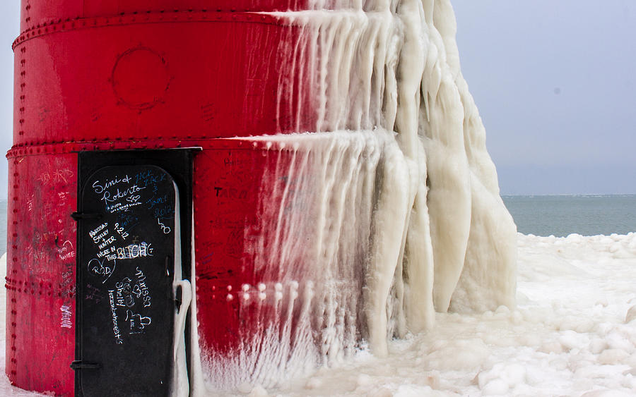 South Haven Lighthouse door Frozen Photograph by Joe Holley