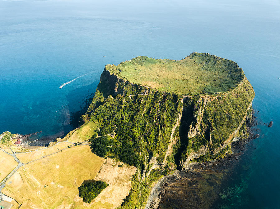 South Korea: Seongsan Ilchulbong crater in Jeju Island Photograph by Quynh Anh Nguyen