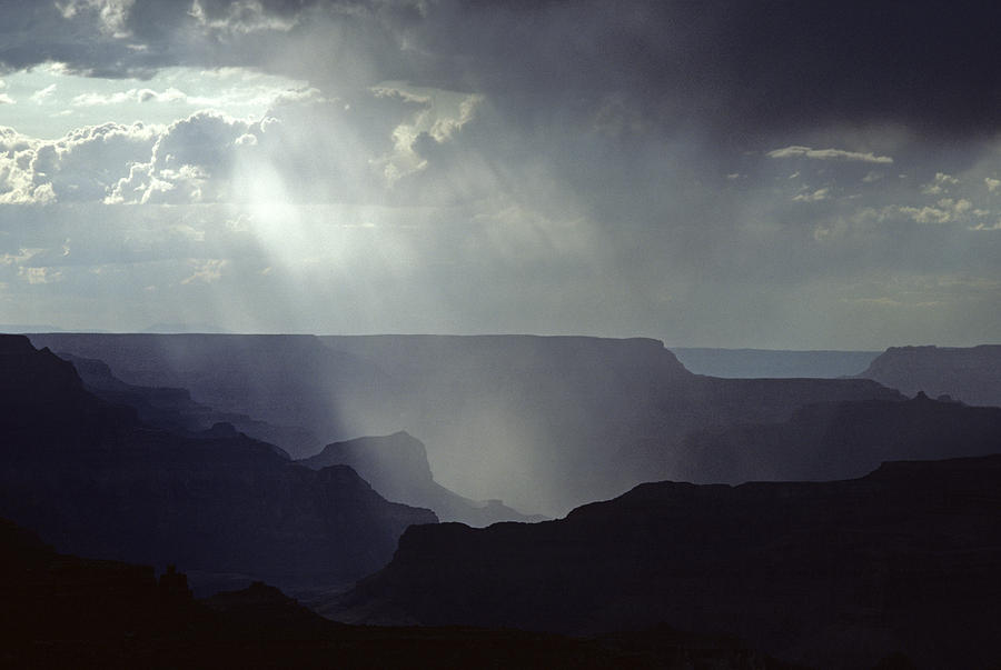 South Rim Grand Canyon storm clouds and light on rock formations Photograph by Jim Corwin