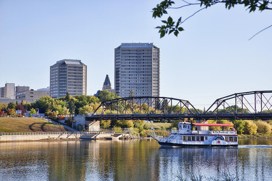 South Saskatchewan River in Downtown Saskatoon with Riverboat Photograph by Dougall_Photography