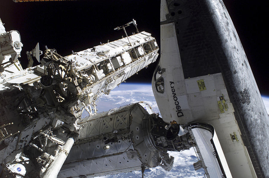 Space Shuttle docked to the International Space Station. Photograph by Stocktrek Images