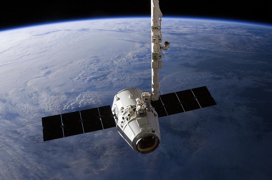 Space Photograph - SpaceX Dragon capsule at the ISS by Science Photo Library