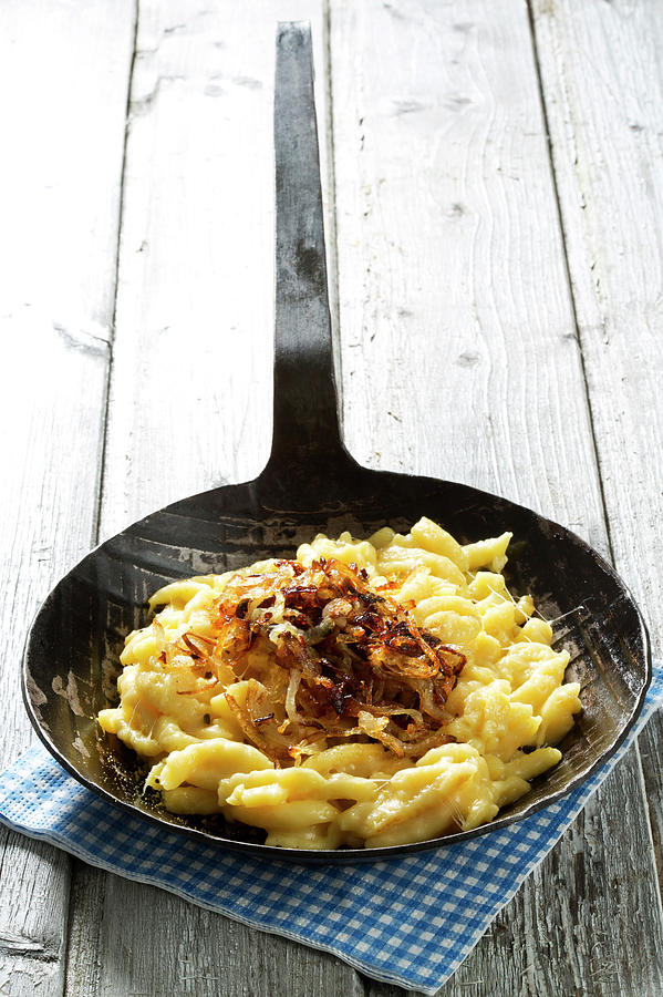 Spaetzle With Cheese And Roasted Onions Photograph by Westend61