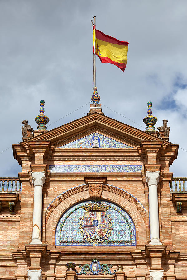 Spanish Flag and Crest on Plaza de Espana Pavilion in Seville Photograph by Artur Bogacki