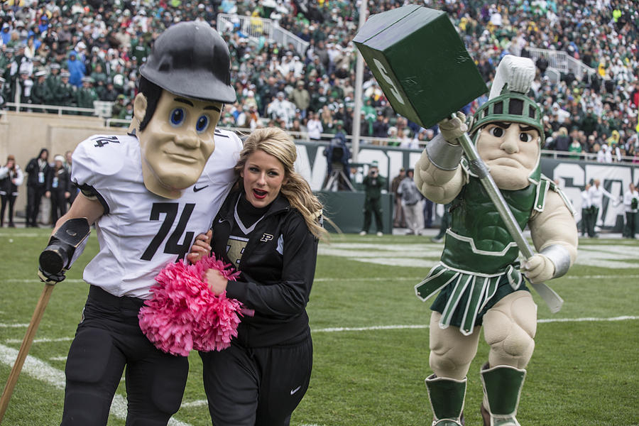 Sparty chasing Purdue Pete  Photograph by John McGraw