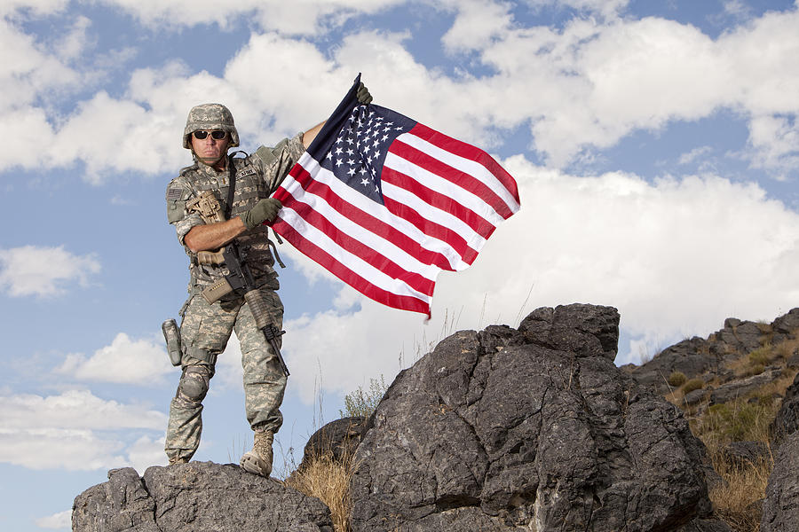 Special ops military soldier holding an american flag Photograph by Inhauscreative