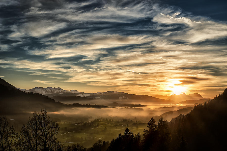 spectacular sunset over landscape at European alps in winter Photograph by Assalve