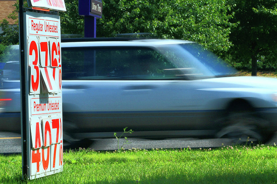 Sign Photograph - Speeding Gas Prices by Karol Livote