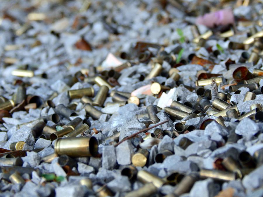 Spent Bullet Casings Photograph by Christopher Mahoney - Pixels
