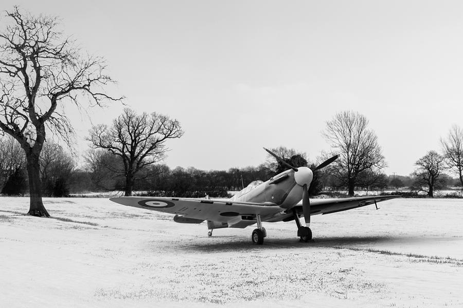 Spitfire in the snow black and white version Digital Art by Gary Eason