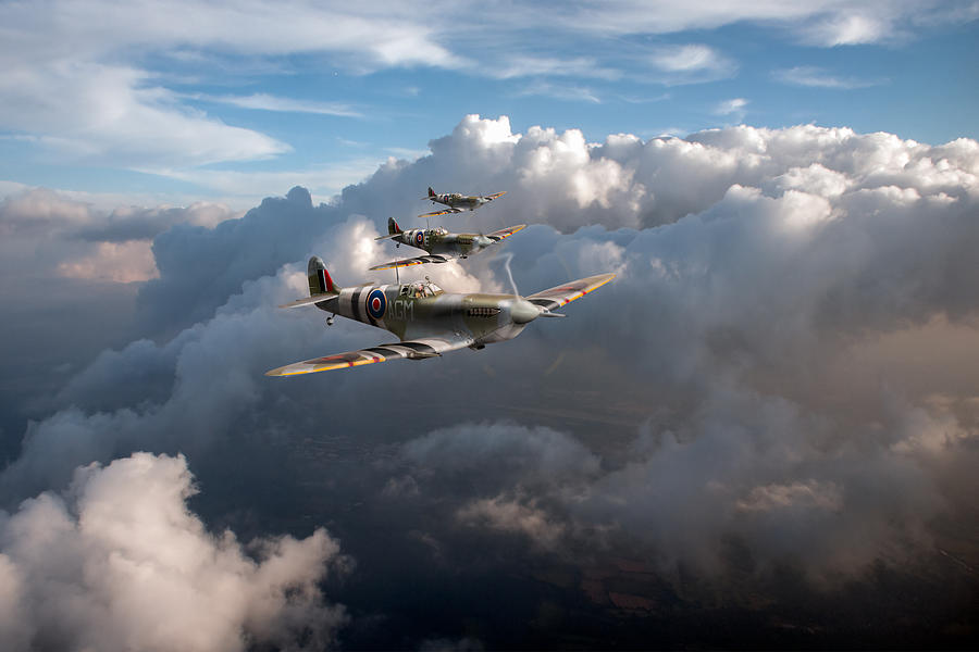 Spitfires among clouds Photograph by Gary Eason