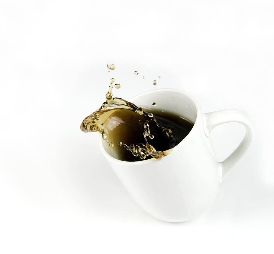 Splashing Cup of Coffee with Copy Space Photograph by Alynst