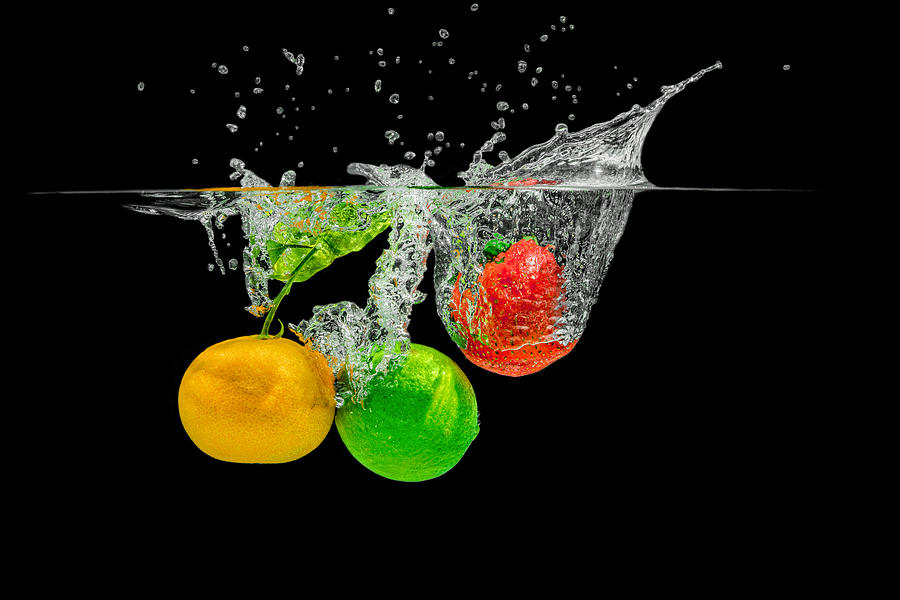 Splashing Fruits Photograph by Peter Lakomy