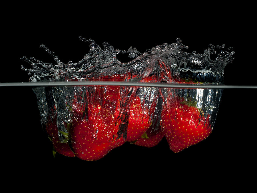 Splashing strawberries Photograph by Mike Santis
