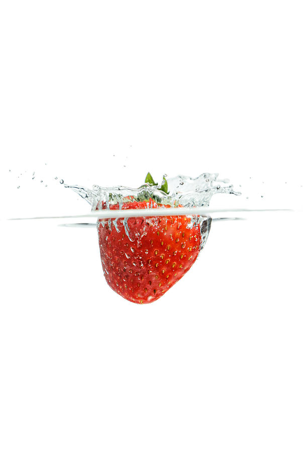 Splashing Strawberry Photograph by Peter Lakomy