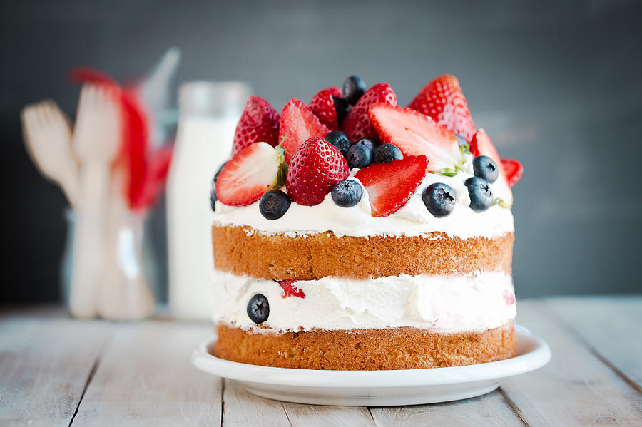Sponge cake with strawberries, blueberries and cream Photograph by Mrs_2015