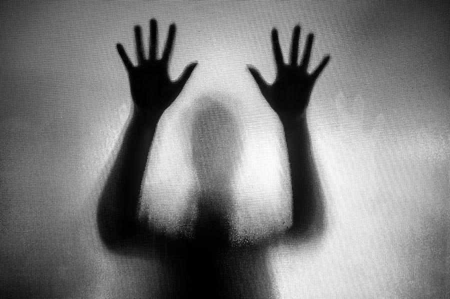 Spooky silhouette of woman with hands pressed against glass window Photograph by Coldsnowstorm Spooky silhouette of woman with hands pressed against glass window Photograph by Coldsnowstorm