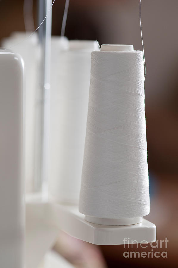 Spools Of White Thread On Serger Photograph by Jim Corwin