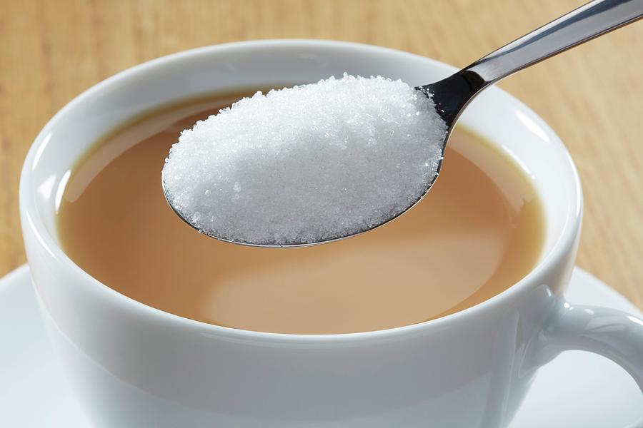 Spoonful Of Sugar And Hot Drink Photograph by Kevin Curtis/science Photo Library