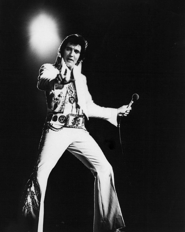 Elvis Presley Photograph - Spotlight Behind Elvis Presley by Retro Images Archive