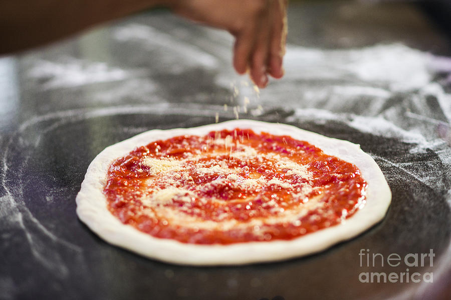 Sprinkling Cheese On Home Made Pizza Photograph by JM Travel Photography
