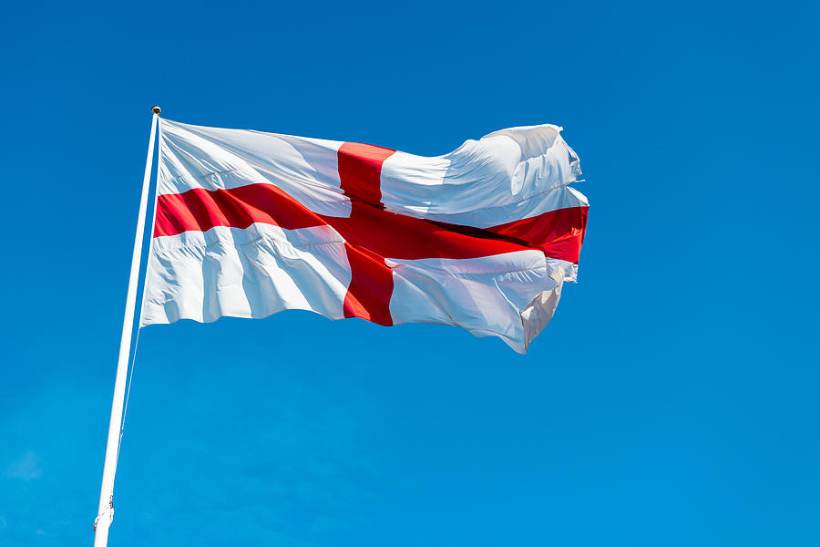 St George Cross Flag of England against a Blue Sky Photograph by Tim Grist Photography